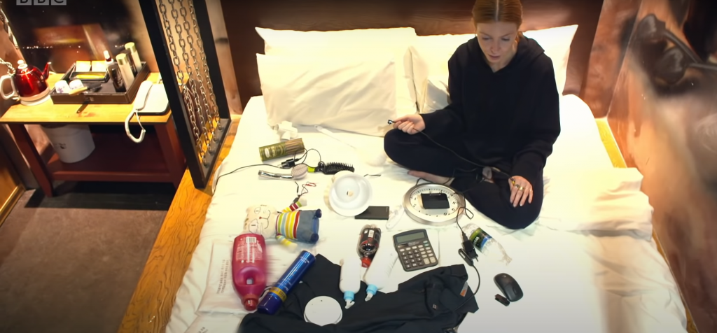 BBC reporter Stacey Dooley is surrounded by various items hiding molkas, the South Korean word for hidden or spy cameras.