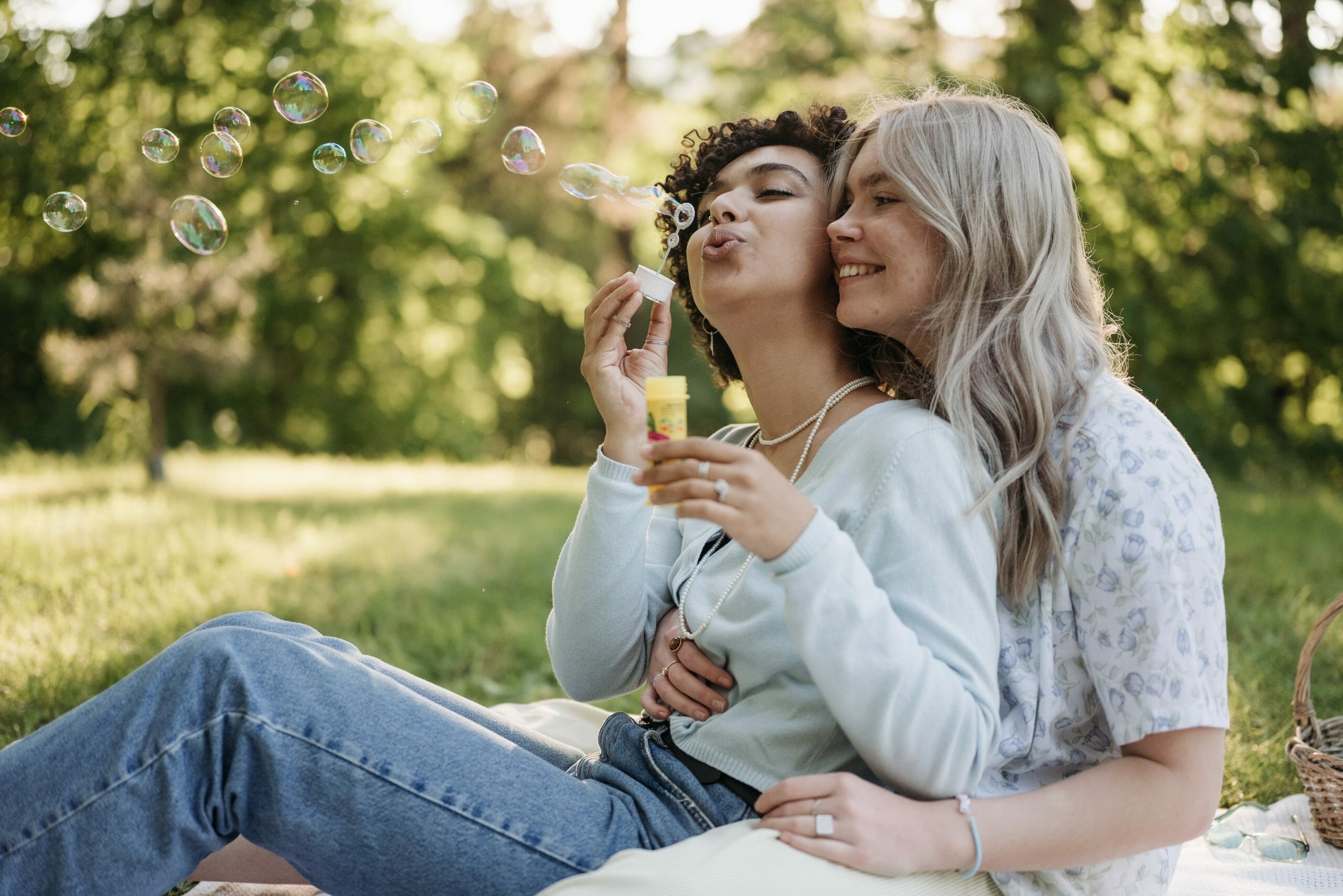 White lesbian couple enjoying a picnic