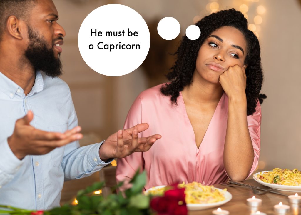 Bored Black woman on a dinner date thinking he must be a Capricorn
