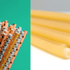 Paper straws on green background compared to pasta straws