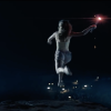 The female in the image is jumping off a cliff whilst holding a torch.