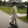 Girl on skateboard.