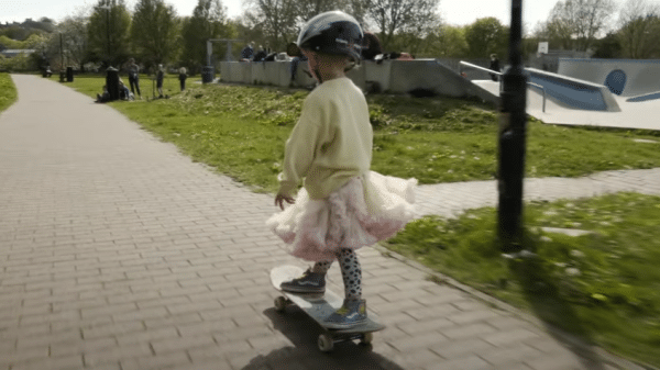 Girl on skateboard.