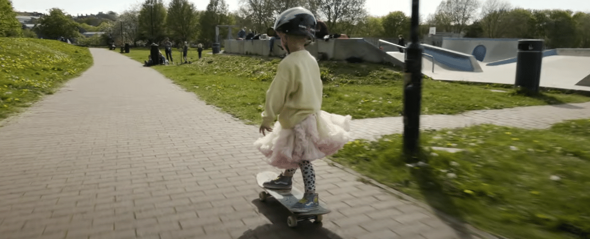 Girl on skateboard.