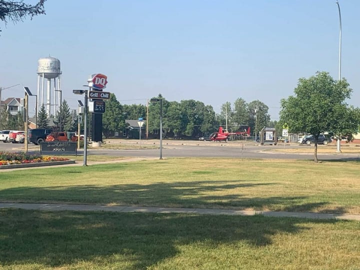 Helicopter landing outside Dairy Queen ice cream store