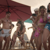 The participants are dancing on the beach.
