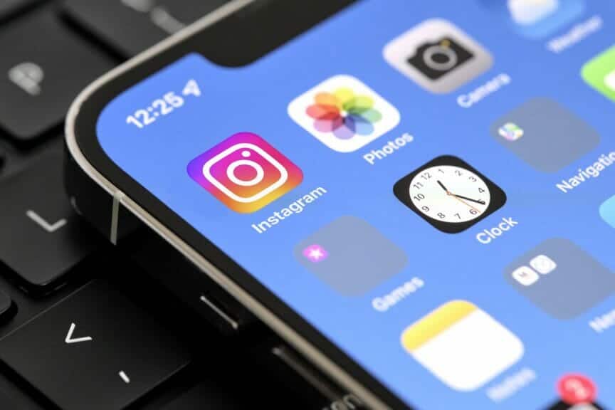 An iPhone with apps on it including Instagram