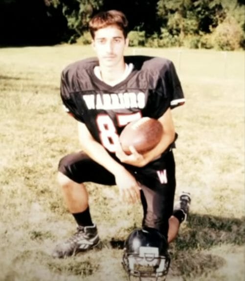 Syed in high school football jersey. Date unknown.