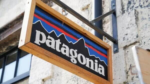 Patagonia clothing store sign with stone wall behind