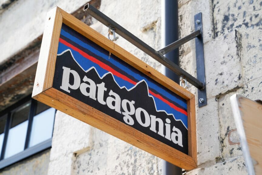 Patagonia clothing store sign with stone wall behind