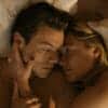 Jack Chambers (Harry Styles) and Alice (Florence Pugh) lie intimately in bed