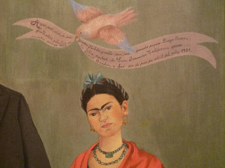 Painting of Frida Kahlo with a bird and banner