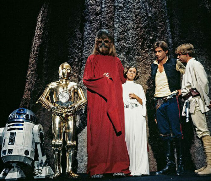 The Star Wars gang surround Chewie for a life day celebration