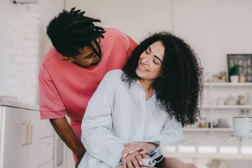 Couple smiling at each other playfully