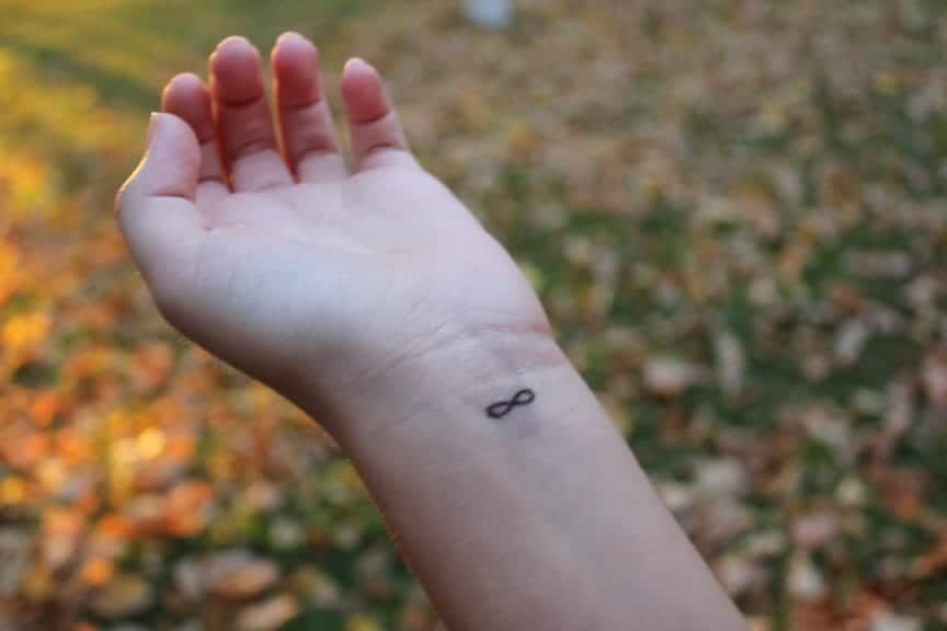 Wrist with infinity sign tattoo