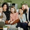 Jewish family watching a video on laptop.