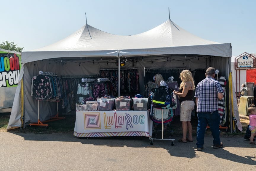 A photograph of a LuLaRoe booth, set up by one of the MLM's independent sellers.