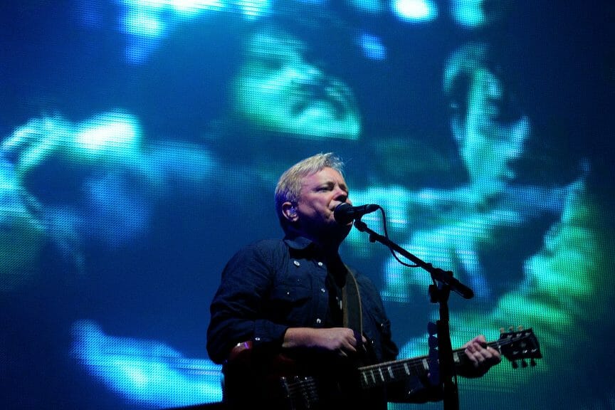 New Order performing for fans at a concert (Christian Bertrand/Shutterstock)