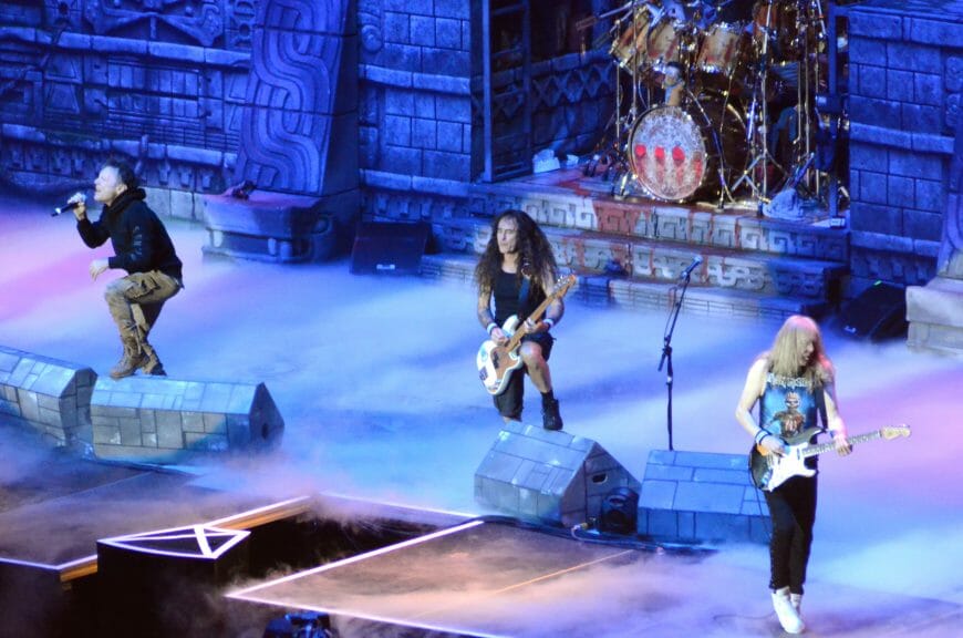 Iron Maiden performing a concert for fans (Bruce Alan Bennett/Shutterstock)