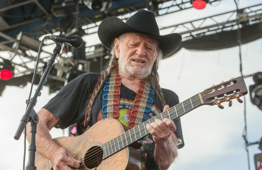 Rock and Roll Hall of Fame nominee Willie Nelson performing at a concert (Sterling Munksgard/Shutterstock)
