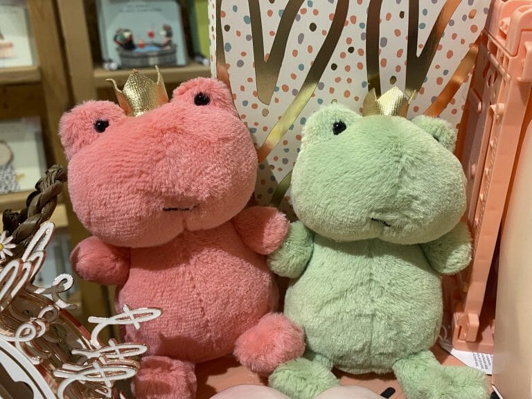 Pink and green Jellycat frogs with crowns on.
Is this Jellycats' version of Princess and the Frog? - They're bound to become a TikTok favourite!