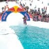 A retro skier glides across the pool of water at the pond skimming event at Holiday Valley in Ellicottville, New York.