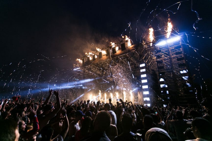 Concert scene with stage and crowd. 