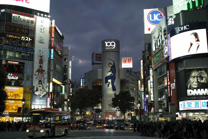 The outside of Shibuya 109, a department store, at night.