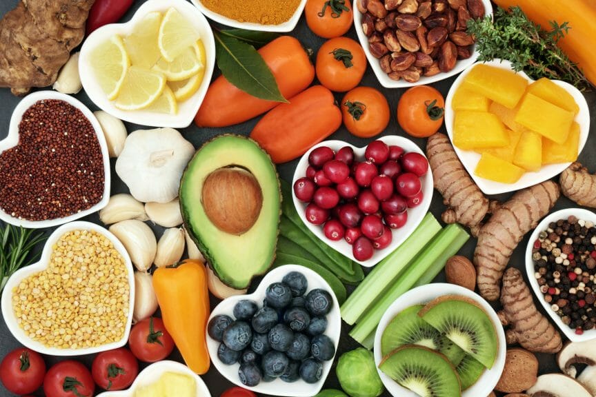 Table with a wide variety of fruits and vegetables. 