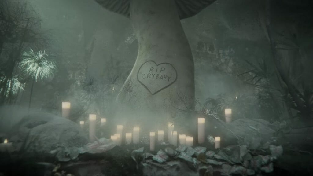 A mushroom in a foggy forest with "RIP Cry Baby" carved into it. Credit: melanie martinez/YouTube