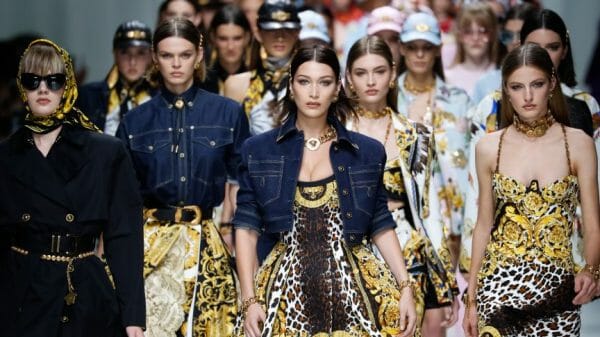 Models walk the runway finale at the Versace show during Milan Fashion Week Spring/Summer 2018 on September 22, 2017 in Milan, Italy. Shutterstock. Fashionstock.com