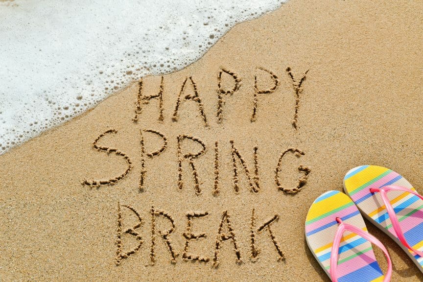 "Happy Spring Break" written in the sand (Nito/Shutterstock)