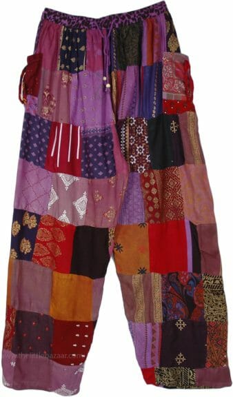 Purple/red/orange patchwork pants with white background.