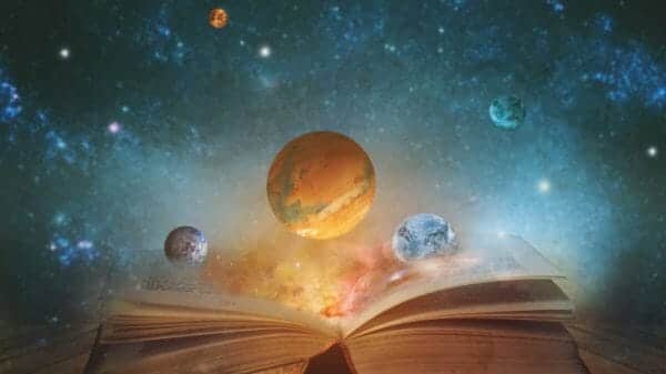 A picture of planets floating above an open book.