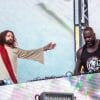 Shaq aka Diesel performs with a Jesus impersonator at Lollapalooza in Grant Park, Chicago.