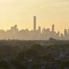 A red haze is visible over the New York City skyline as the Canadian wildfires intensify. Credit