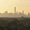 A red haze is visible over the New York City skyline as the Canadian wildfires intensify. Credit