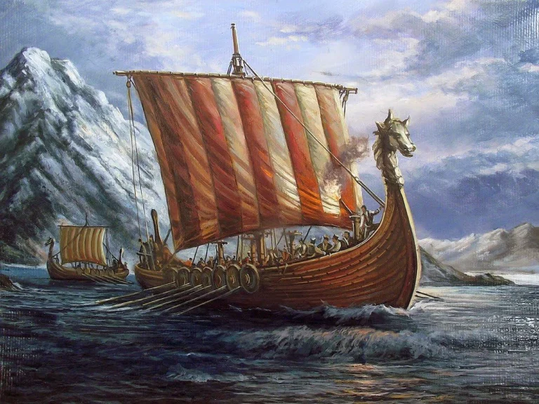 Viking ship with red and white sail rowing away from mountain on the sea.