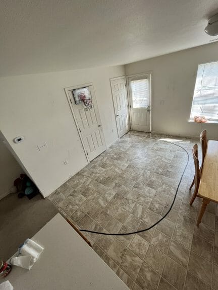 A basketball court in the kitchen of a college apartment