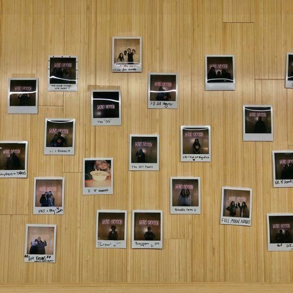 What a college apartment Polaroid wall looks like