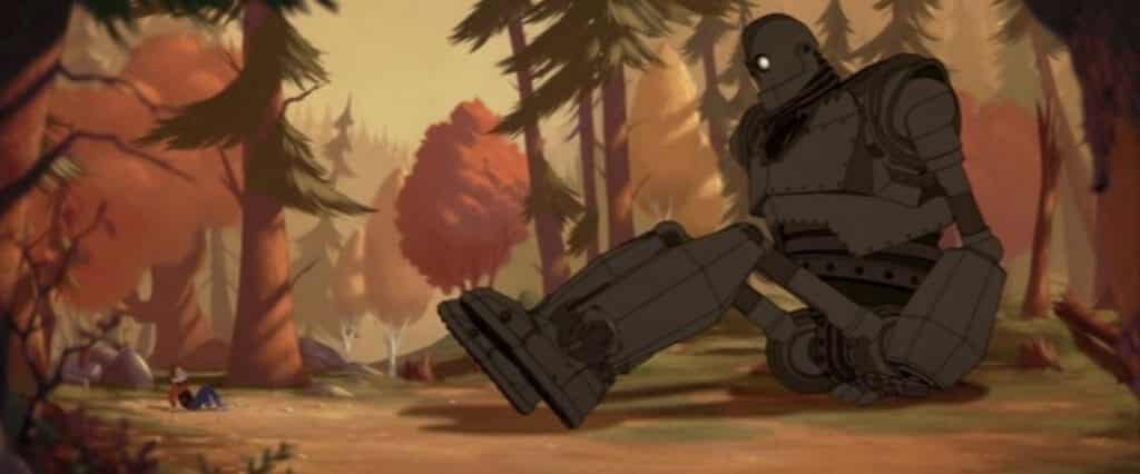 A giant alien robot and a young boy, Hogarth, sit across from one another in a beautiful autumn forest.