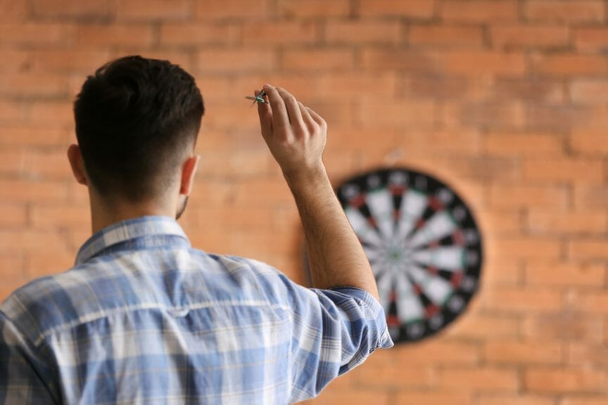 Man playing darts