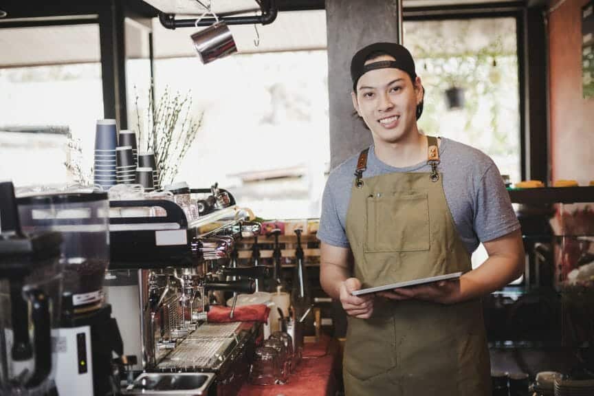 A college student working as a barista aside from class times.