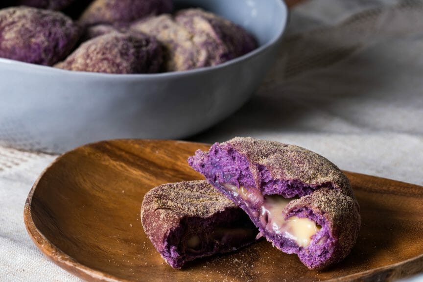 Cross section of ube cheese pandesal, traditional Filipino pastry