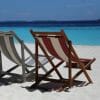 Two sunbeds on a beach