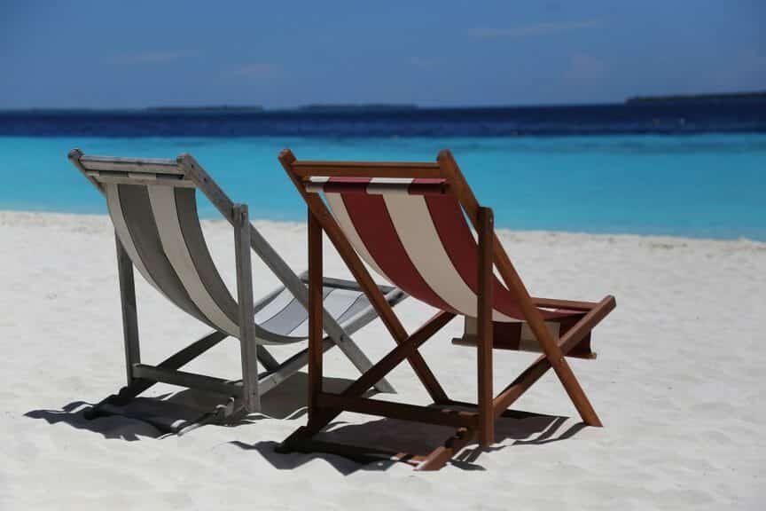 Two sunbeds on a beach