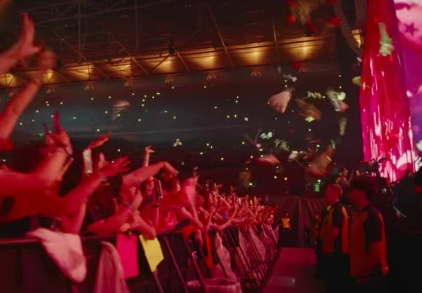 Fans showering Harry Styles with flowers at a 'Love On Tour' performance.
