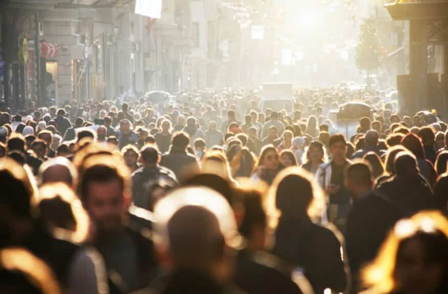 Blurred crowds of unrecognizable people on the street.