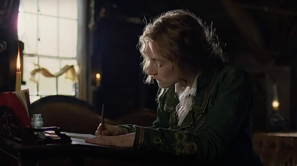 Film still of Jo March writing, in Greta Gerwig's 'Little Women'