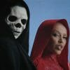 Doja cat wearing a red dress, standing next to the Grim Reaper. Both look at the camera.